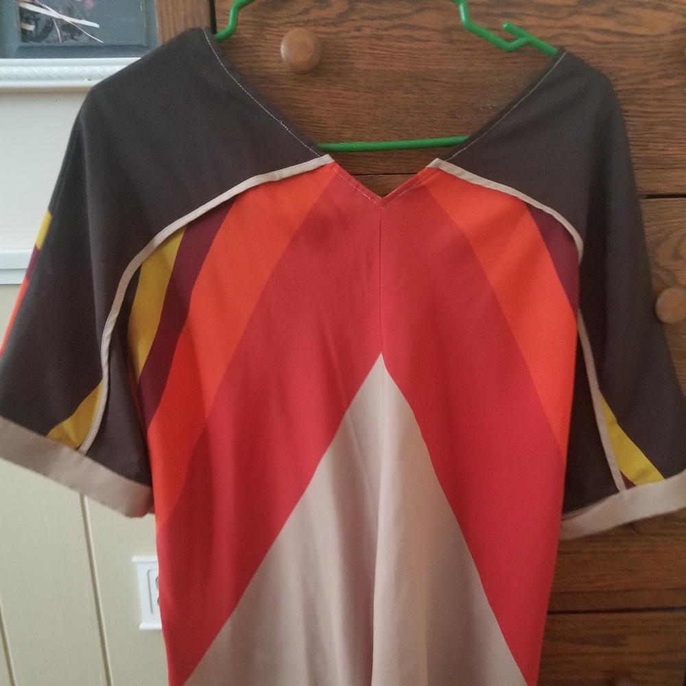 Orange, brown, yellow and cream blouse